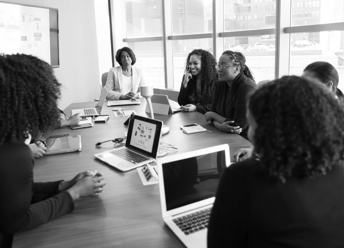 Professional women leaders collaborating at an Ad-frican event